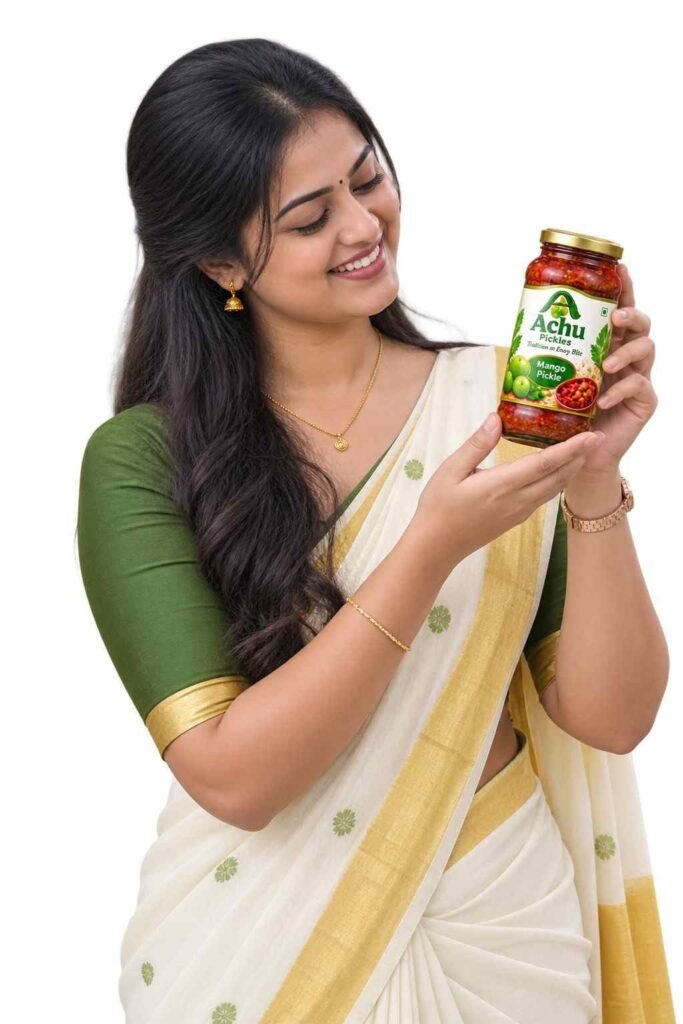 Kerala homemade pickles – woman holding a jar of traditional mango pickle